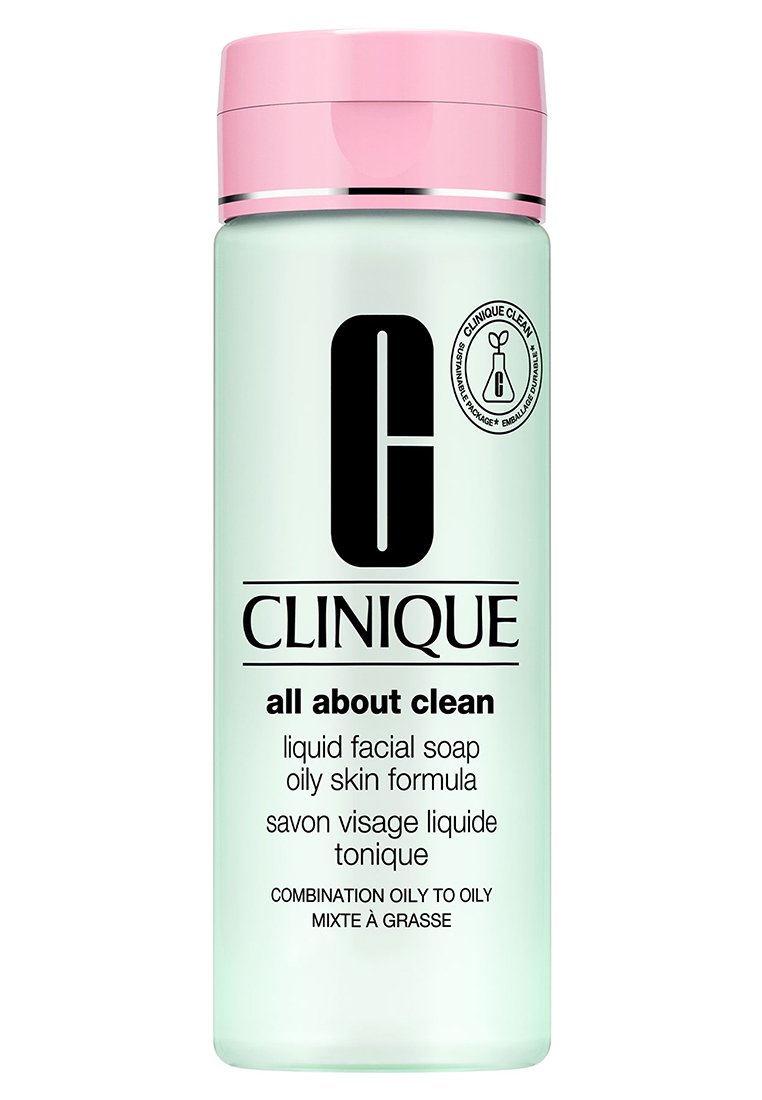 Bottiglia verde menta con un coperchio rosa, etichettata "Clinique All About Clean," per pelle grassa, con testo nero e logo.