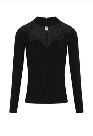 Haut noir à manches longues avec un décolleté en dentelle aux motifs complexes, un col montant et une fermeture éclair au dos. Texture lisse dans l'ensemble.