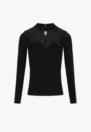 Haut noir à manches longues avec un décolleté en dentelle aux motifs complexes, un col montant et une fermeture éclair au dos. Texture lisse dans l'ensemble.