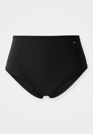 Svart høyt liv bikini undertøy med minimal søm og en liten Tommy Hilfiger-logo øverst til høyre.