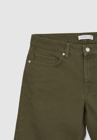 Pantaloni in corduroy verde oliva scuro con vita media, zip e design a cinque tasche con accessori in tonalità argentata.