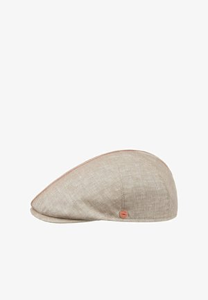 Light beige linen flat cap with subtle stitching details and a small round copper emblem on the side.