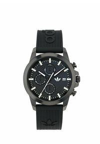 Orologio analogico nero con cinturino in gomma testurizzata, cassa rotonda, tre sotto-quadranti e dettagli argentati a segnare le ore. Presenta un logo alle 3.