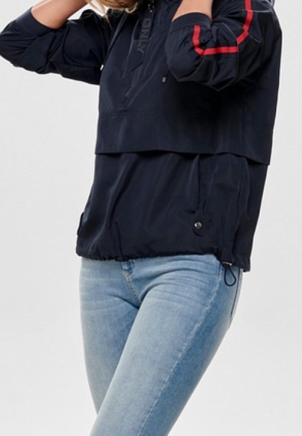 Navy windbreaker with red stripes, lightweight fabric, two front pockets, and adjustable drawstring hem. Stylish pullover design, zippered collar.