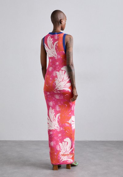 Maxi dress with a vibrant pink and orange floral pattern, ribbed blue neckline, and white accents. Made of a textured knit material.