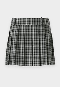 Gonna svasata a quadri bianco e nero con vita liscia e molte pieghe verticali. Realizzata in tessuto leggero.