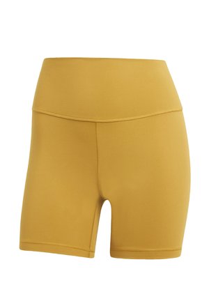 Gele elastische sportshorts met een brede tailleband, gladde textuur en een lengte tot midden boven de dij. Flatlock naden voor extra comfort.