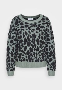 Stickad tröja i dämpad grön med svart leopardmönster. Har ribbad nederkant och ärmar, rund hals och avslappnad passform. Strukturerad tyg.