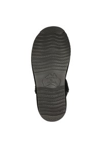 Black rubber shoe sole featuring a wavy tread pattern, stamped "WARMBAT AUSTRALIA," with ridged accents for grip and durability.