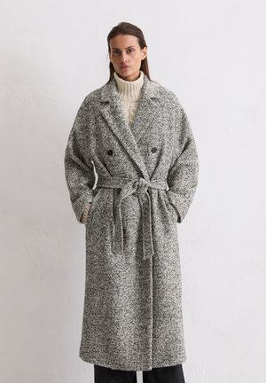 Gray and white speckled wool coat with double-breasted design, belted waist, large collar, and wide sleeves. Textured fabric.