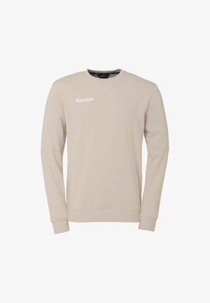 Beige Langarm-Sweatshirt aus Baumwollmischung mit Rundhalsausschnitt und gerippten Bündchen. "Kempa"-Logo in Weiß auf der Vorderseite aufgedruckt.