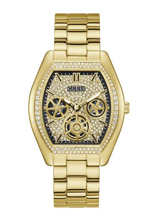 Orologio da polso Guess tonalità oro con quadrante incrostato di cristalli, tre sottoquadranti e bracciale in metallo dorato abbinato.