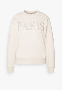 Felpa crema con polsini e orlo a costine, caratterizzata da ricamo "PARIGI" nella parte frontale in un color beige chiaro. Design classico con collo a giro.