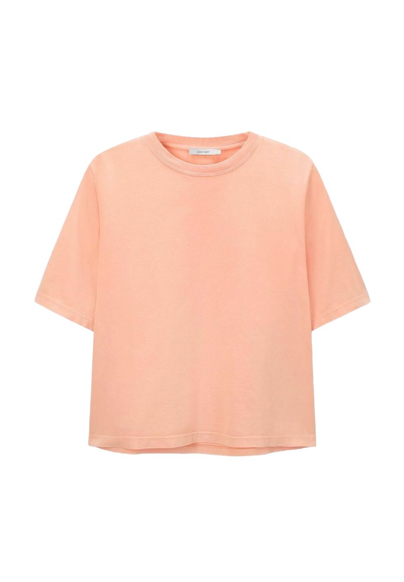 T-shirt à manches courtes en coton corail doux. Présente une coupe décontractée et une texture lisse avec un ourlet droit.