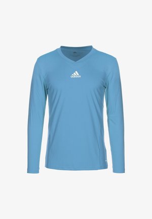 T-shirt de sport à manches longues bleu clair avec un col en V, fabriqué en tissu lisse ; présente un logo Adidas blanc sur la poitrine.