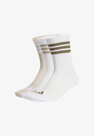 Trzy pary skarpetek do załogi: jedna biała z ciemnozielonymi paskami, jedna biała i jedna beżowa. Wszystkie mają prążkowaną fakturę i detal z logo przy palcach.