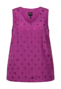 V-hals, mouwloze top in felpaars stof met verhoogde textuurlijke stippen. Gladde textuur met een relaxed fit.