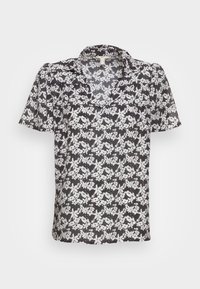 Schwarze Bluse mit kurzen Ärmeln und V-Ausschnitt, die ein florales weißes Muster aufweist und ein leicht gepufftes Schulterdesign hat.