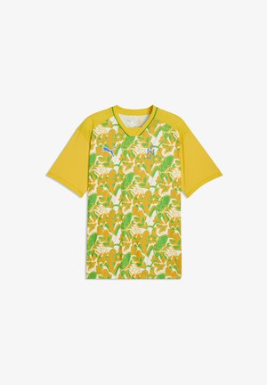 Maillot de sport jaune à manches courtes avec motif floral vert, blanc et orange sur le devant, logo Puma bleu et emblème « N » sur la poitrine.
