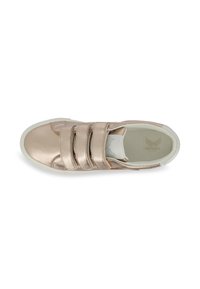 Metallic rose gold sneaker with three velcro straps, white rubber sole, and a smooth texture. Interior features a soft lining.