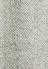 Close-up of coarse woven fabric with a tightly knit pattern in shades of light gray and white.