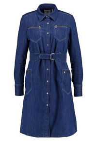 Denimmekko, tummansininen, pitkät hihat, nappikiinnitys edessä, kaulus, kaksi rintataskua vetoketjulla, joustava vyötärö vyöllä ja suora leikkaus.