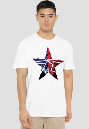 White cotton t-shirt featuring a large, multicolored star graphic in red, blue, and black with abstract patterns and text at the center.
