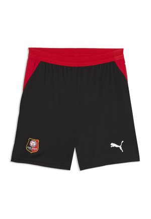 Czarne sportowe spodenki z czerwoną talią i bokami, herb Stade Rennais FC na lewej nogawce, białe logo Puma na prawej nogawce, brak osób na zdjęciu.