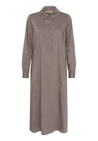 Rudas ilgomis rankovėmis su apykakle, mygtukų užsegimas su metalinėmis mygtukais, krūtinės kišenė ir tiesus kirpimas. Pagamintas iš lygaus audinio.