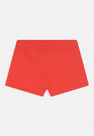 Calções elásticos vermelhos com textura suave e uma cintura elástica larga. Projetados em um estilo ajustado, apresentando uma cor sólida sem padrões.