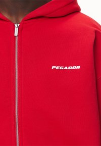 Pegador LOGO OVERSIZED JACKET - Sudadera con cremallera - washed red/white gum