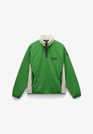 Pullover in pile verde con colletto alto, zip frontale a metà, pannelli laterali crema e una piccola toppa con logo sul petto. Texture liscia.