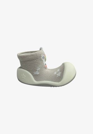 Calzatura calzino beige per bambino piccolo con suola e punta in gomma morbida, caratterizzata da una forma a stella sul tallone e da un motivo animale colorato sulla parte superiore in tessuto.