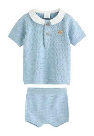 Light blue knitted two-piece outfit featuring a short-sleeve polo shirt with a white collar, wooden buttons, and matching shorts.