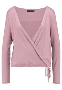 Vaaleanpunainen pitkähihainen kietaisupaita, jossa on syvä V-kaula-aukko ja koottu helma. Sivussa on nauhakiinnitys, ja se on valmistettu pehmeästä, joustavasta kankaasta.