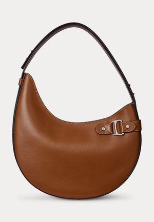 Brown leather crescent-shaped shoulder bag with dark brown adjustable strap and silver buckle detail on front side.