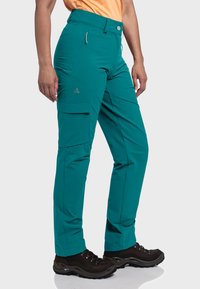 Tealfarbene Outdoor-Hosen mit Cargo-Taschen aus leichtem Stoff. Sie verfügen über eine taillierte Taille, Gürtelschlaufen und ein dezentes Logo auf der linken Seite.