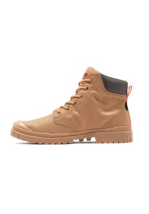Tan ankle boots with a smooth textile upper, rubber sole, and black leather accent at the cuff. Features orange pull tab and lace-up design.
