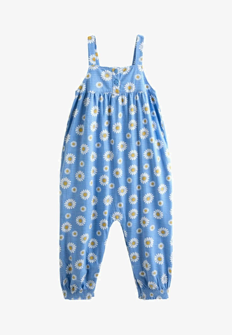 Combinaison bleue pour tout-petit avec imprimé de marguerites blanches et jaunes, bretelles, boutons à l'avant et poignets élastiqués aux chevilles.