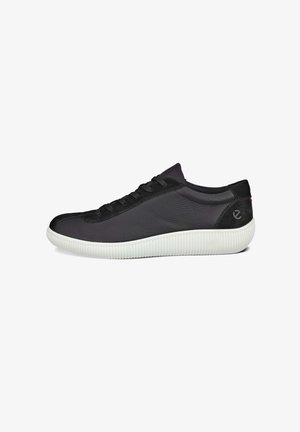 Black leather sneakers with a textured side, black laces, and a white rubber sole with ridges. Subtle logo on the heel.