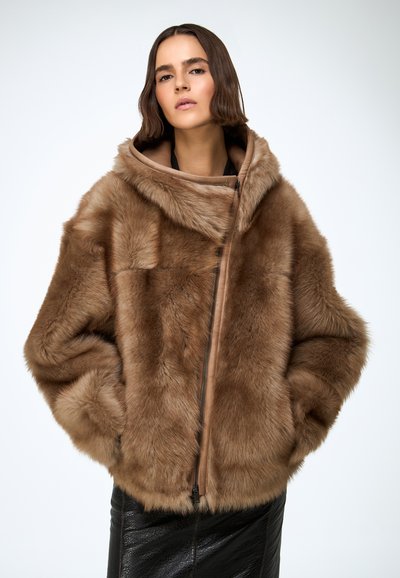 Brown fur coat with a large hood, textured finish, and a front zipper; features soft, plush material with tailored design elements.