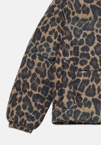 Leopard-print puffer jacket sleeve in brown and black, featuring quilted texture, elastic cuffs, and a side patch pocket design.