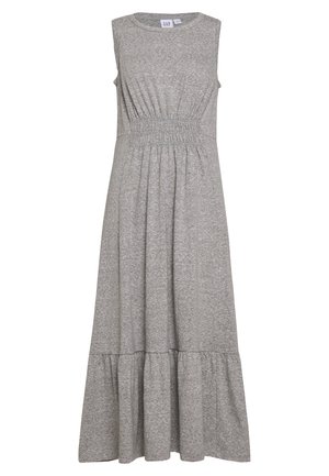 Grå, ærmeløs kjole lavet af strikket stof med en samlet talje og en svunget, lagdelt kant, der har en glat tekstur og et afslappet design.