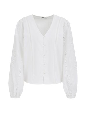 Valge pluus V-kaelusega ja nööpkinnitusega. Pikad läbilõikega varrukad, millel on tikitud augudeta detail. Sile puuvillane kangas.