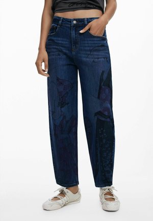 Dark denim jeans with a loose fit featuring graphic patterns in shades of purple and black. Includes front pockets and a button closure.