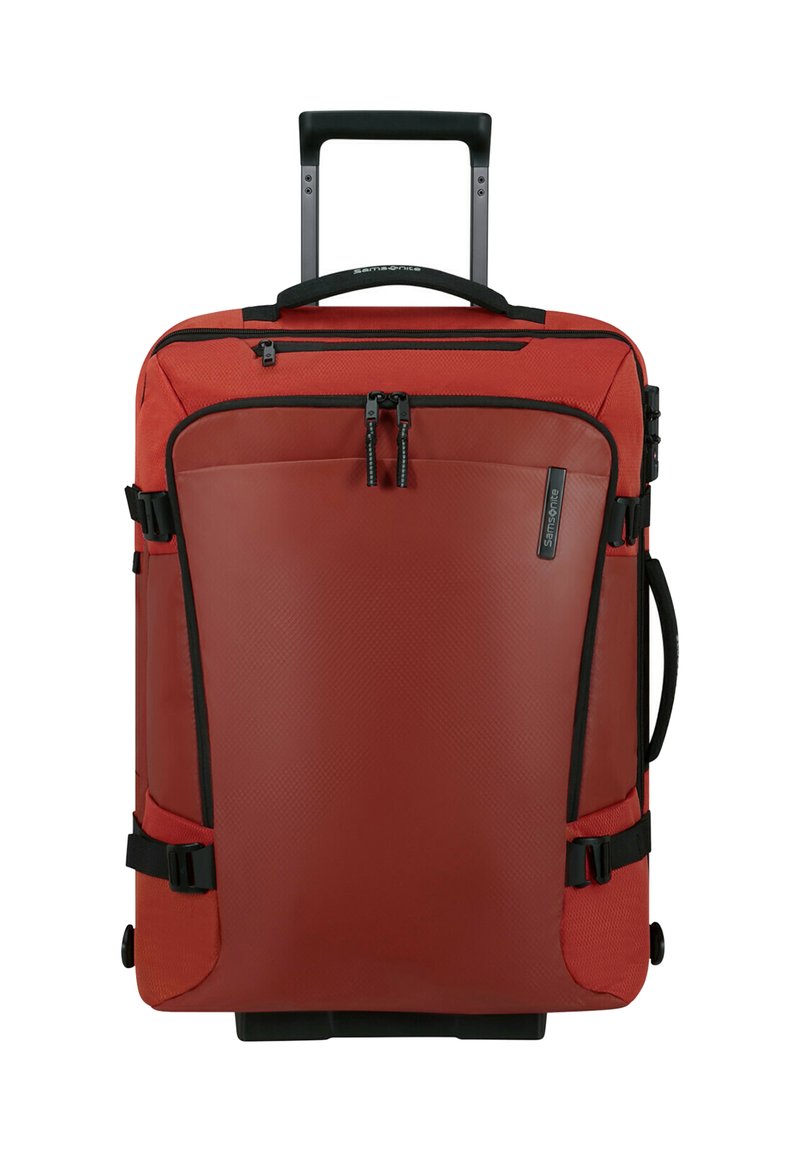 Valigia morbida rossa Samsonite con manico telescopico, tasca frontale con zip, manico laterale e cinghie di compressione nere.