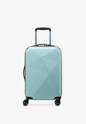 Valigia rigida di colore verde menta, con un design geometrico, dettagli neri, doppie ruote e manico telescopico per una facile manovrabilità.