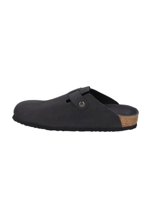 Black slip-on clog made of suede with a round toe, adjustable strap, and cork accent on the heel. Textured rubber outsole.
