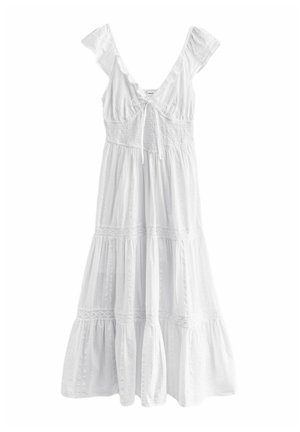 White dress with frill sleeves, a smocked bodice, and tiered skirt. Made from lightweight fabric, featuring lace detailing along the seams.
