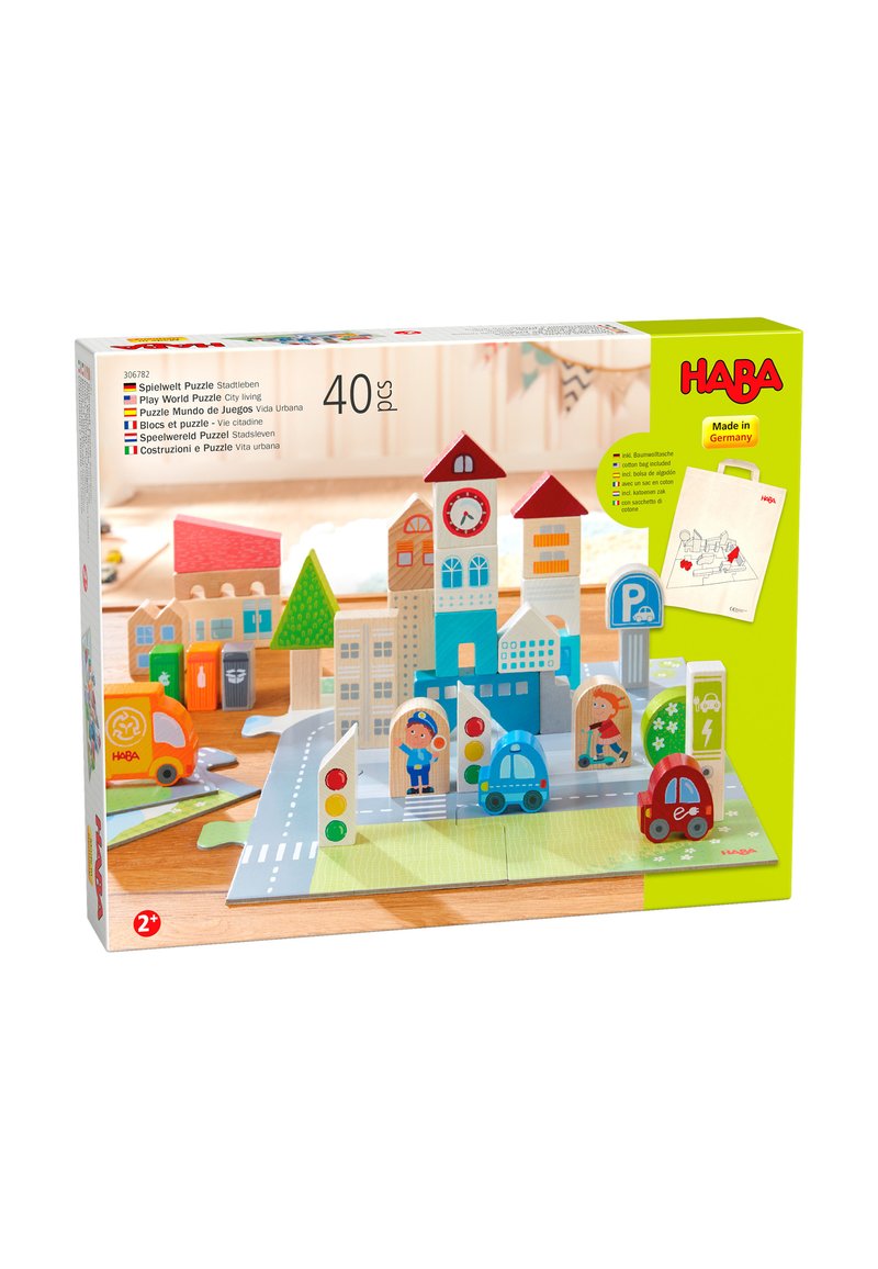 Sada světového puzzle, která obsahuje barevné dřevěné budovy, auta, dopravní značení a silnici, na zelené základně. Obsahuje 40 kusů.